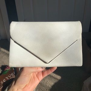 White clutch and shoulder bag